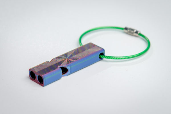 Loud compact whistle